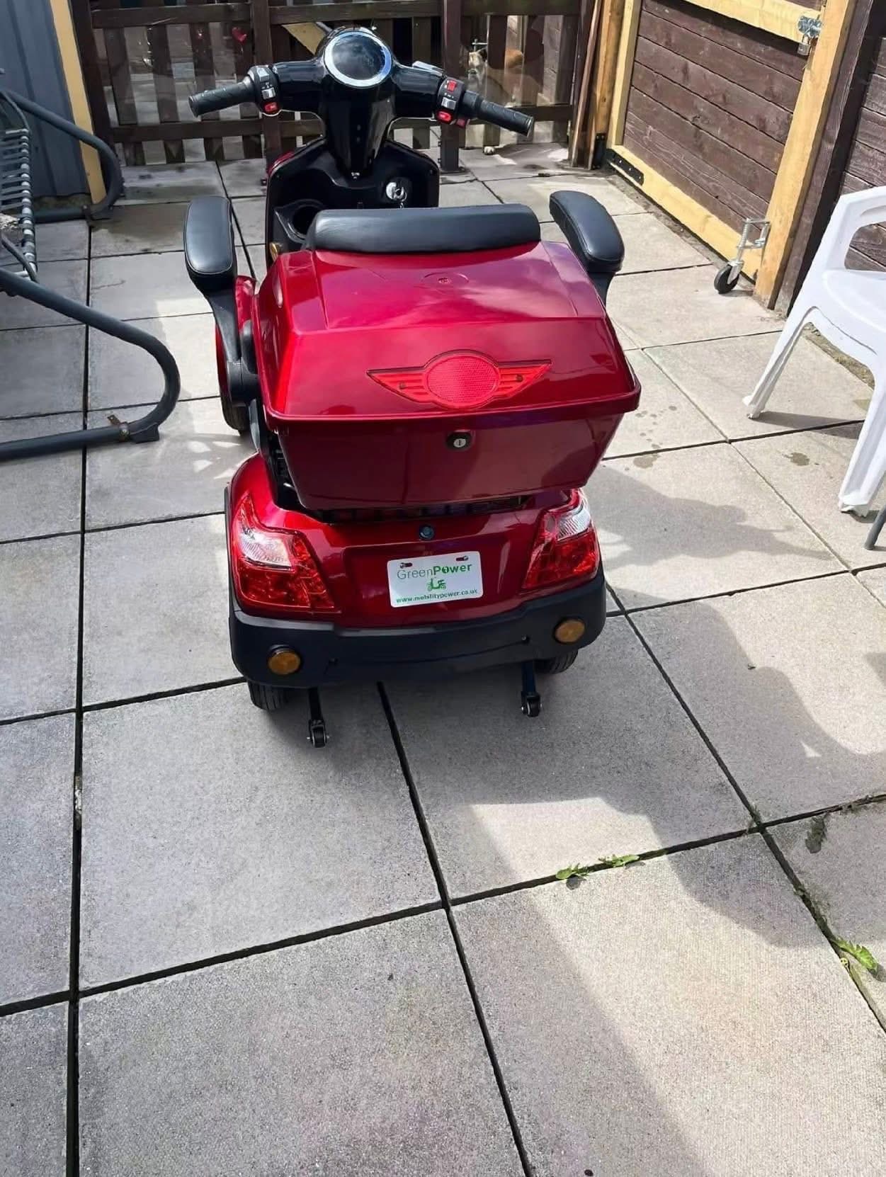 Four wheel electric mobility scooter